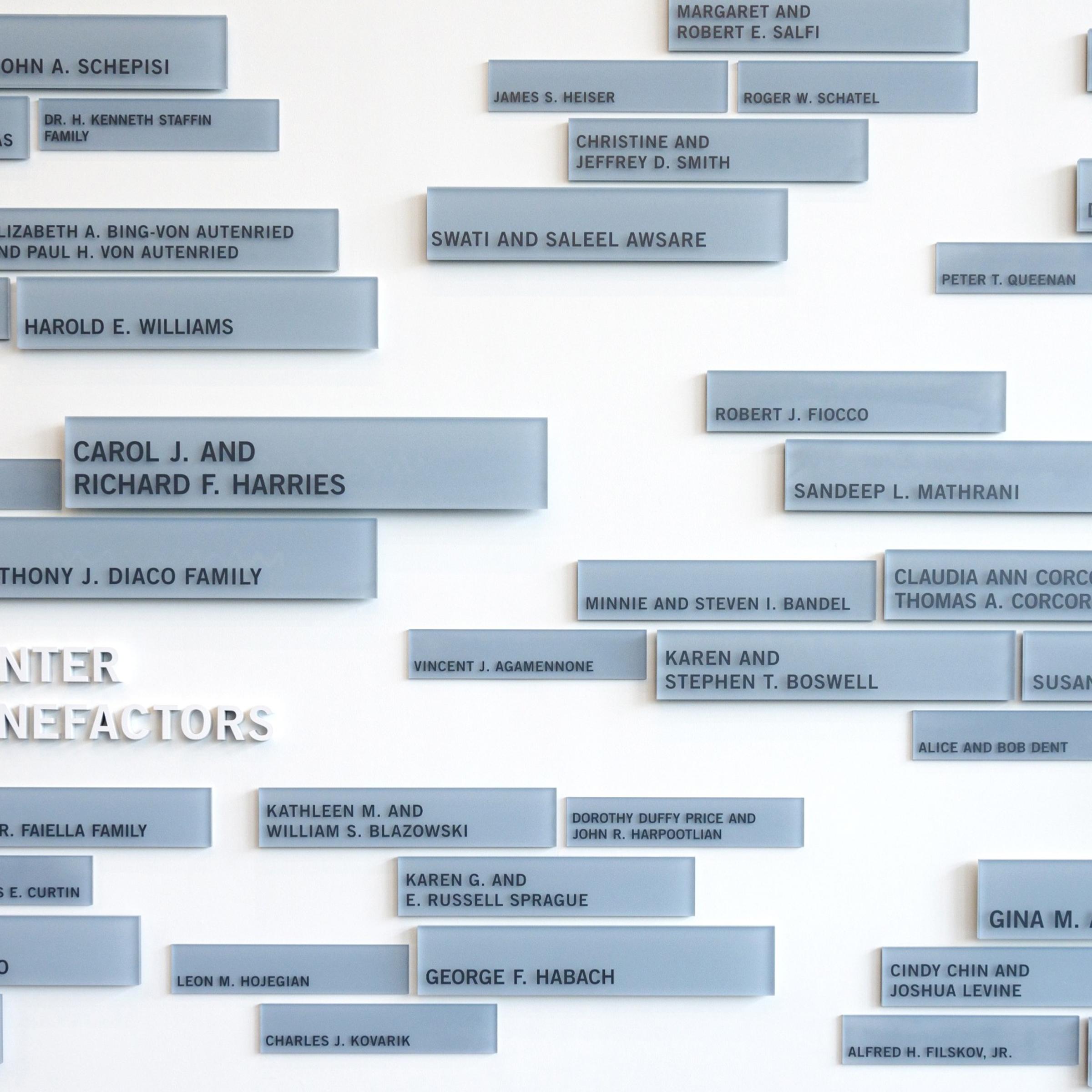 Plaques listing donors on the wall of the UCC.