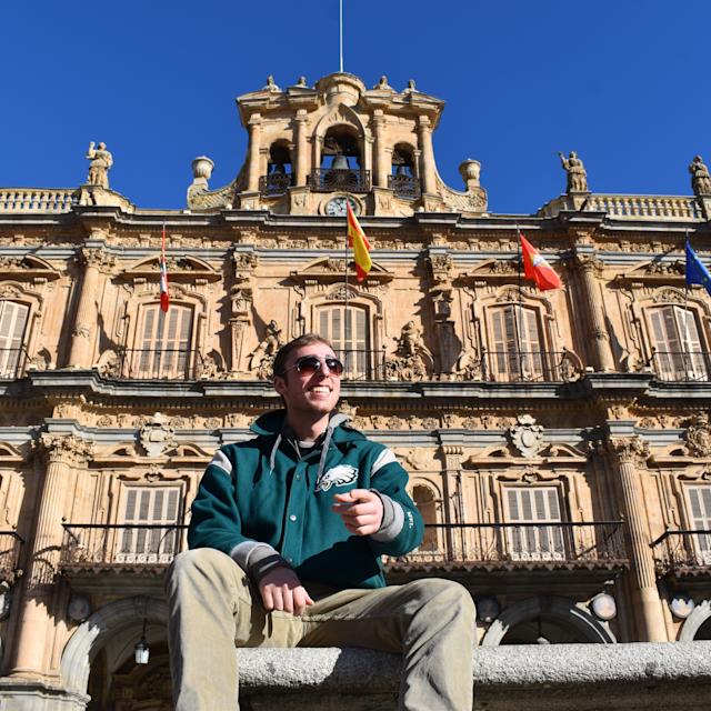 Andon in Spain in front of building with flags