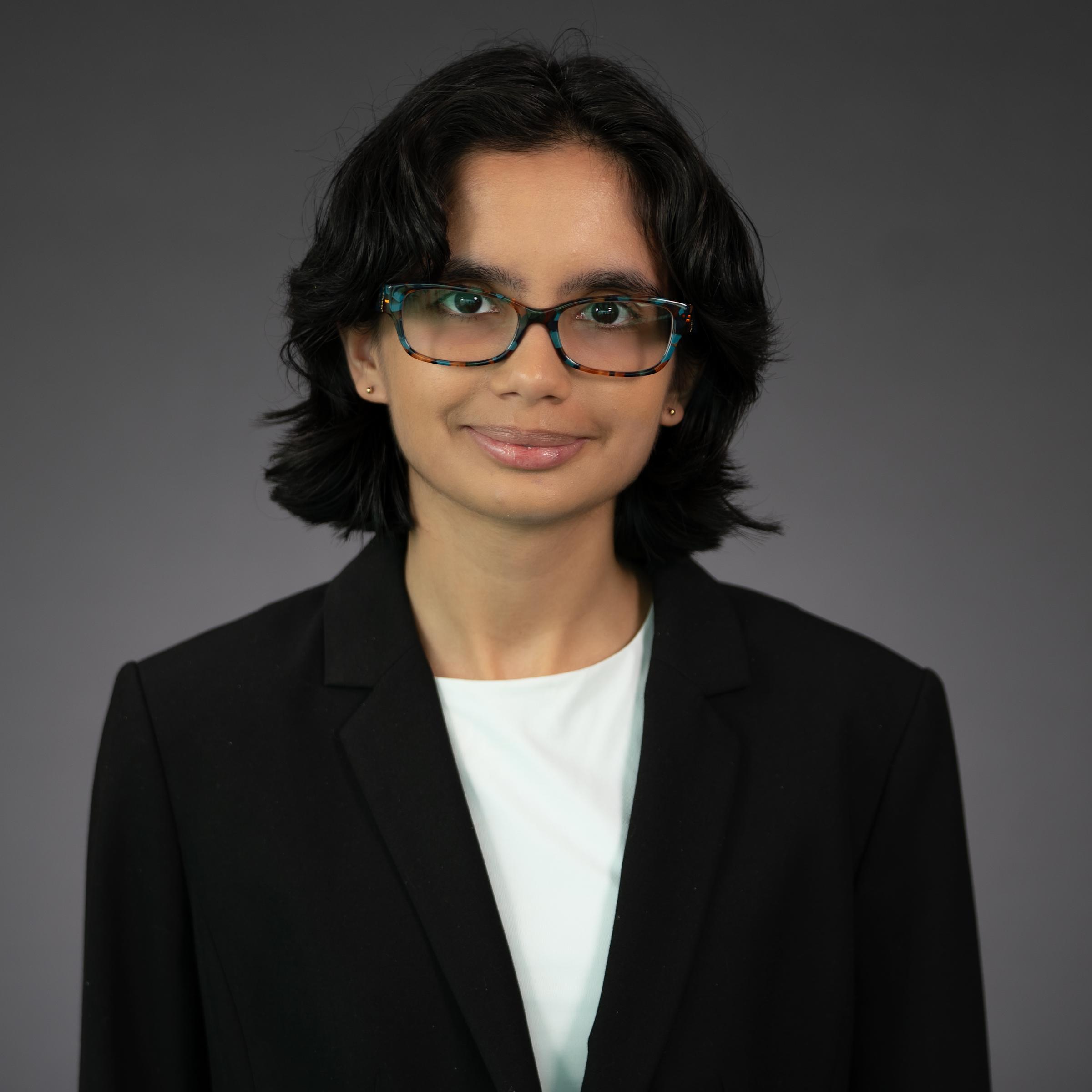 Headshot of Tasha Khosla wearing professional attire.