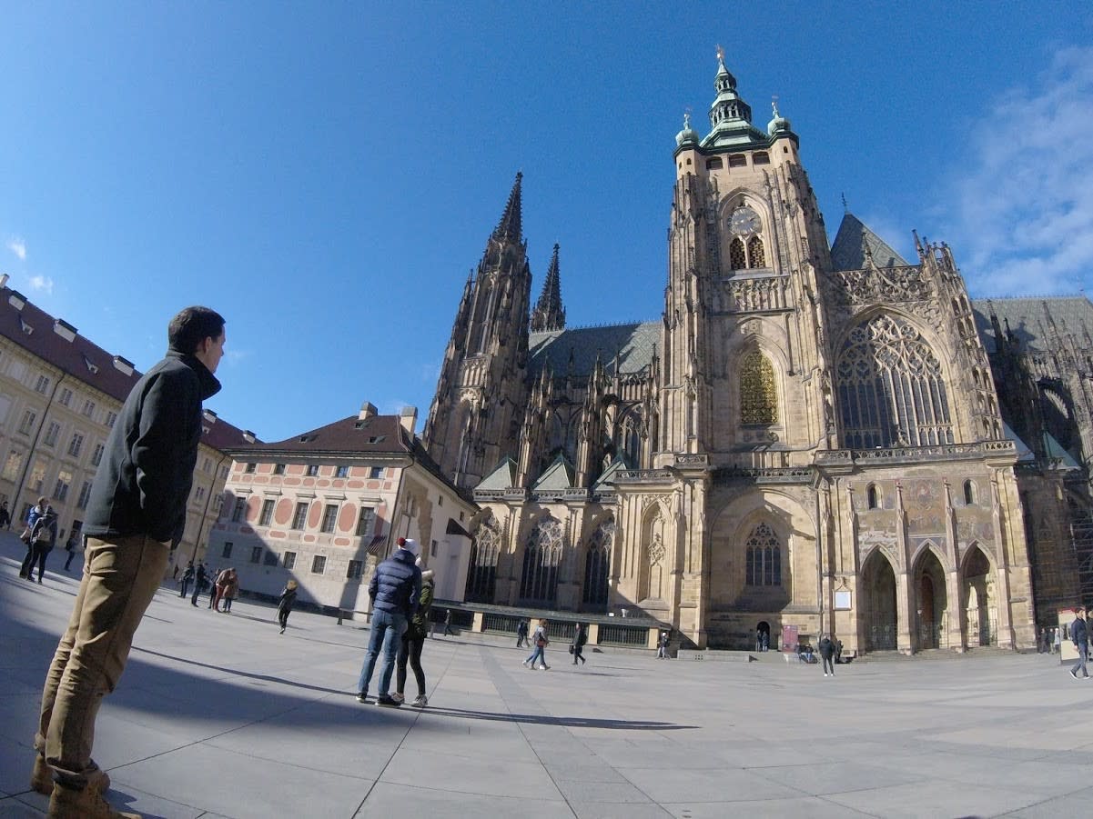 Student next to St. Vitus Cathedral in Prague, Czech Republic