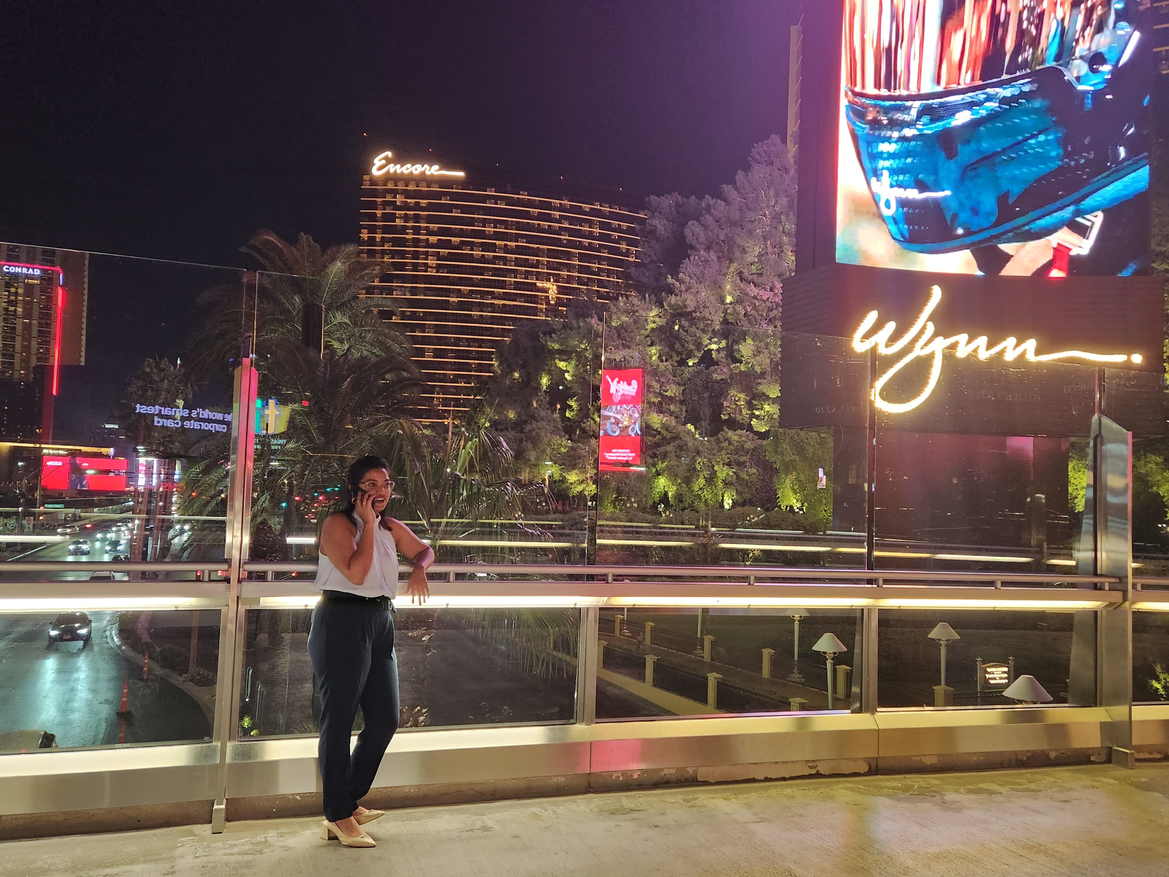 Preeety Vandana talks on the phone outside a Wynn Resorts sign.