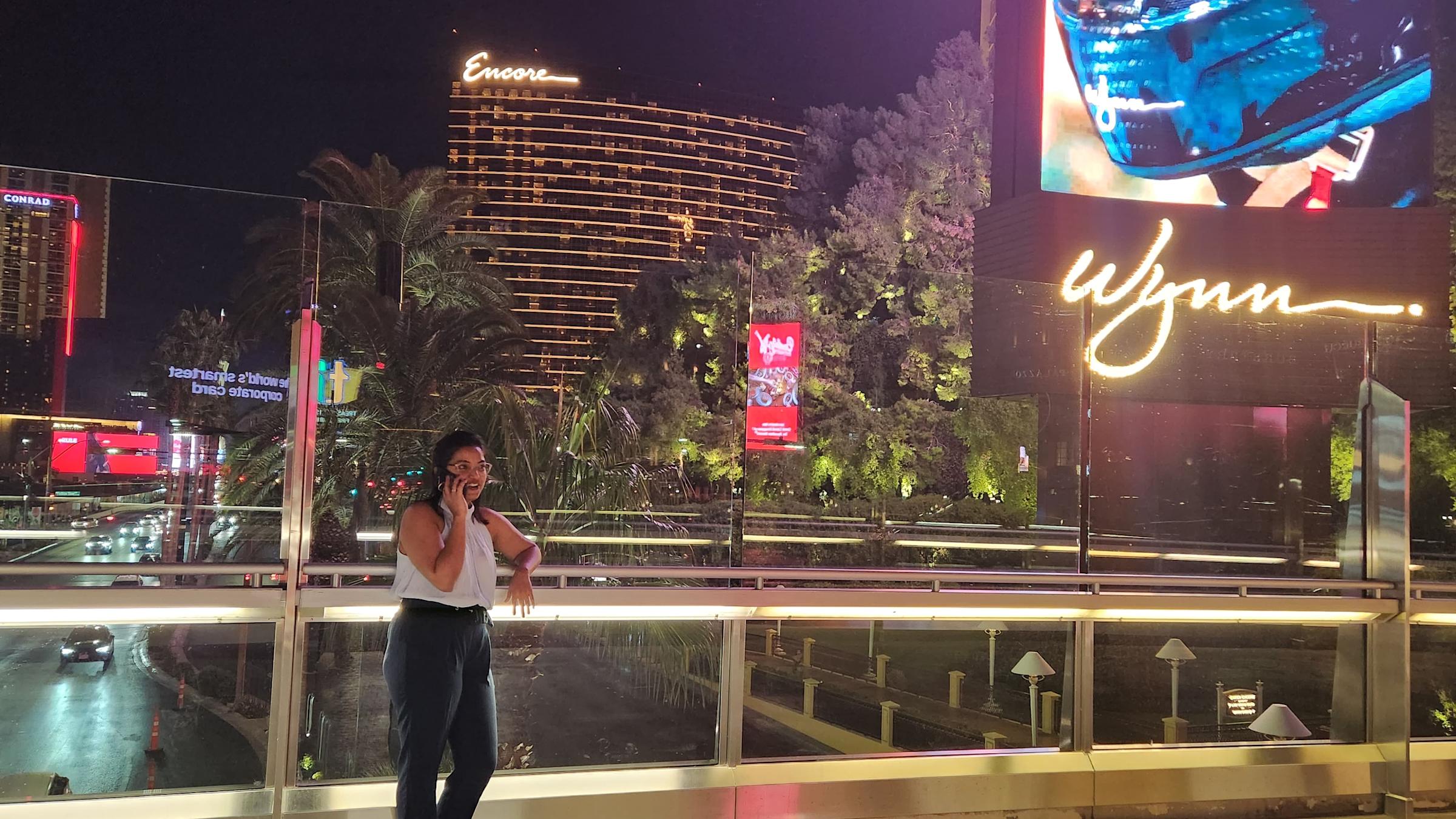 Preeety Vandana talks on the phone outside a Wynn Resorts sign.