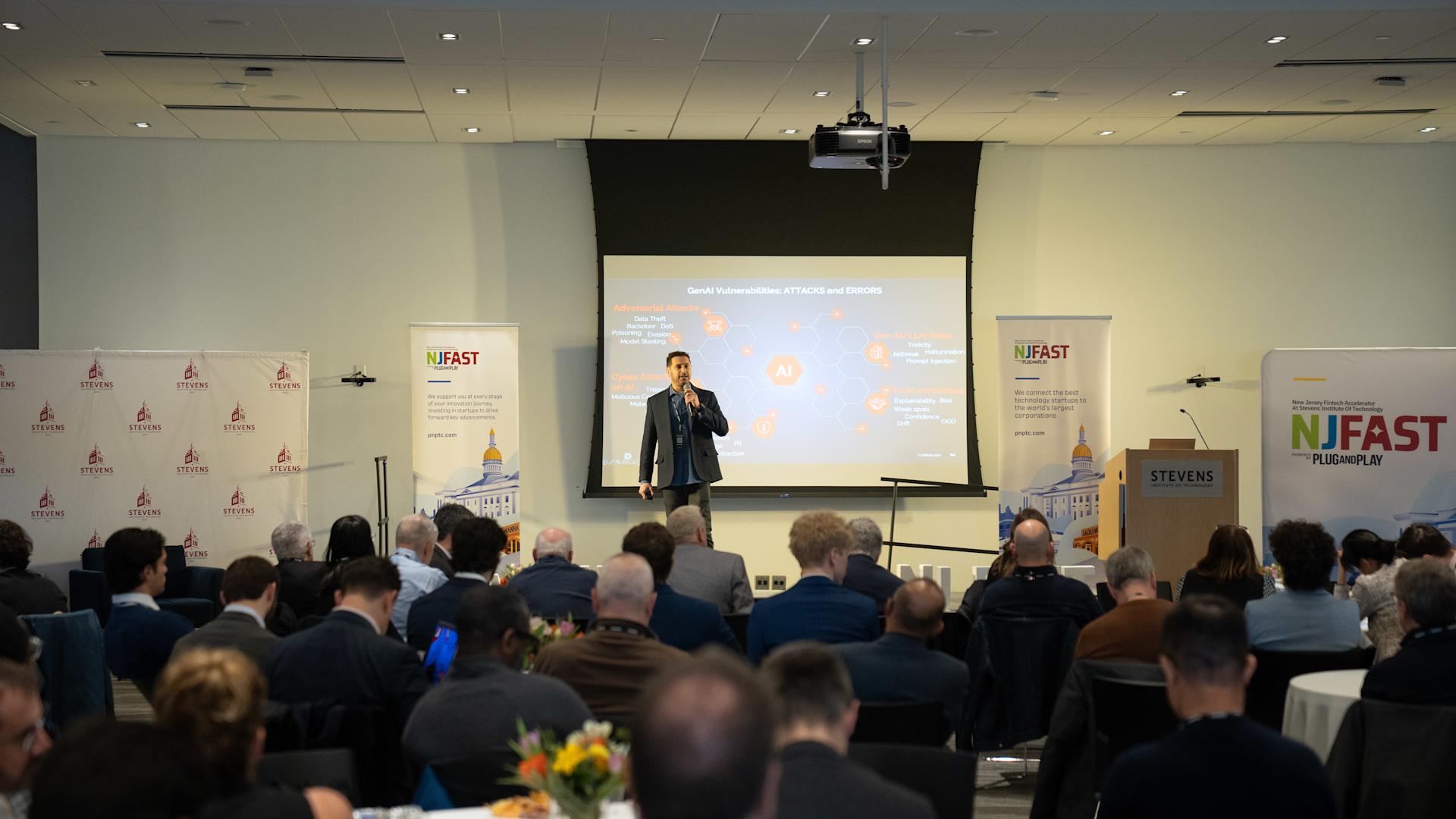 Deepkeep presents their startup to an audience of partners and spectators during an event.