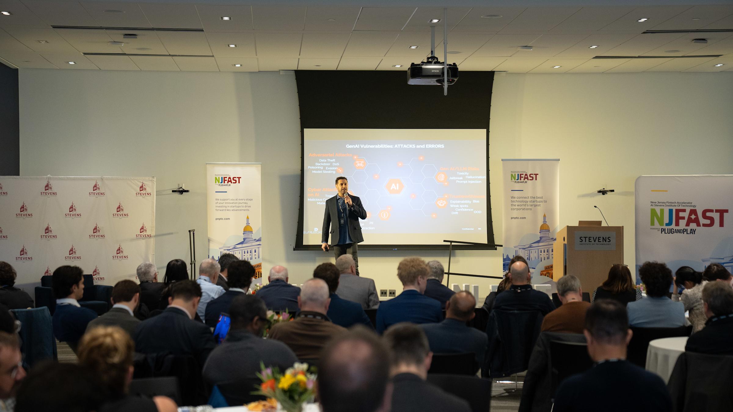 Deepkeep presents their startup to an audience of partners and spectators during an event.