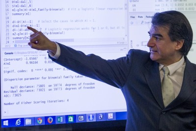 Professor pointing to a line of code