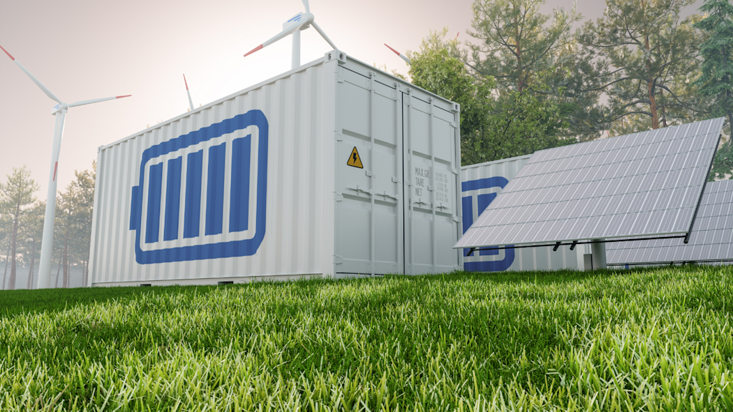 Lithium-ion battery container outdoors next to wind turbines and solar panels.