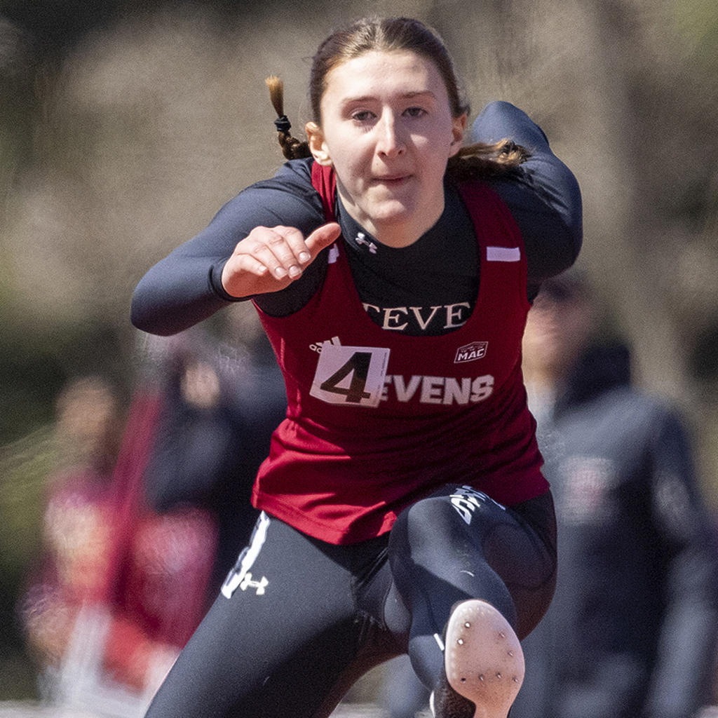 Stevens student-athlete Laura Mathews competing in outdoor hurdles.