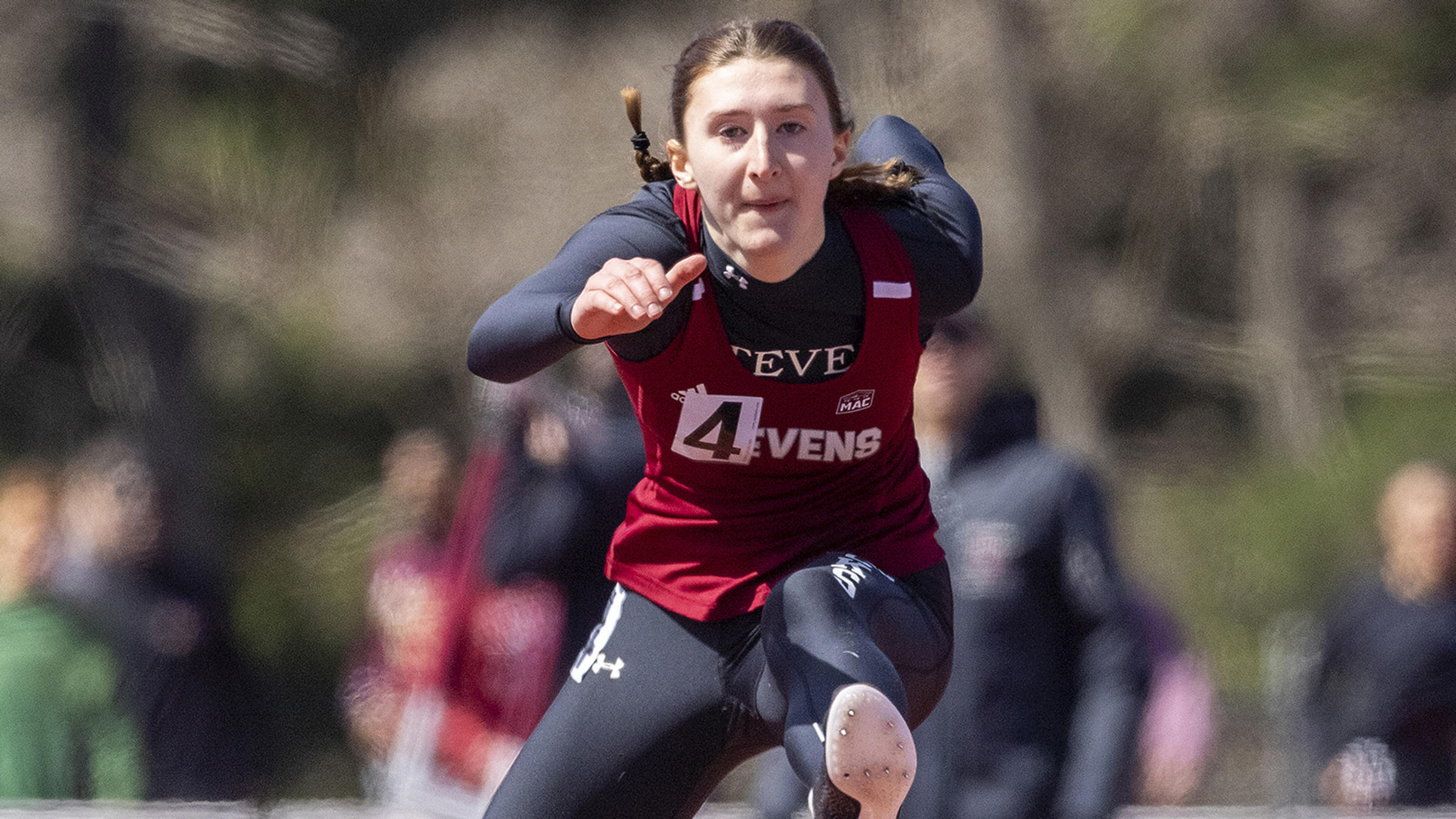 Stevens student-athlete Laura Mathews competing in outdoor hurdles.