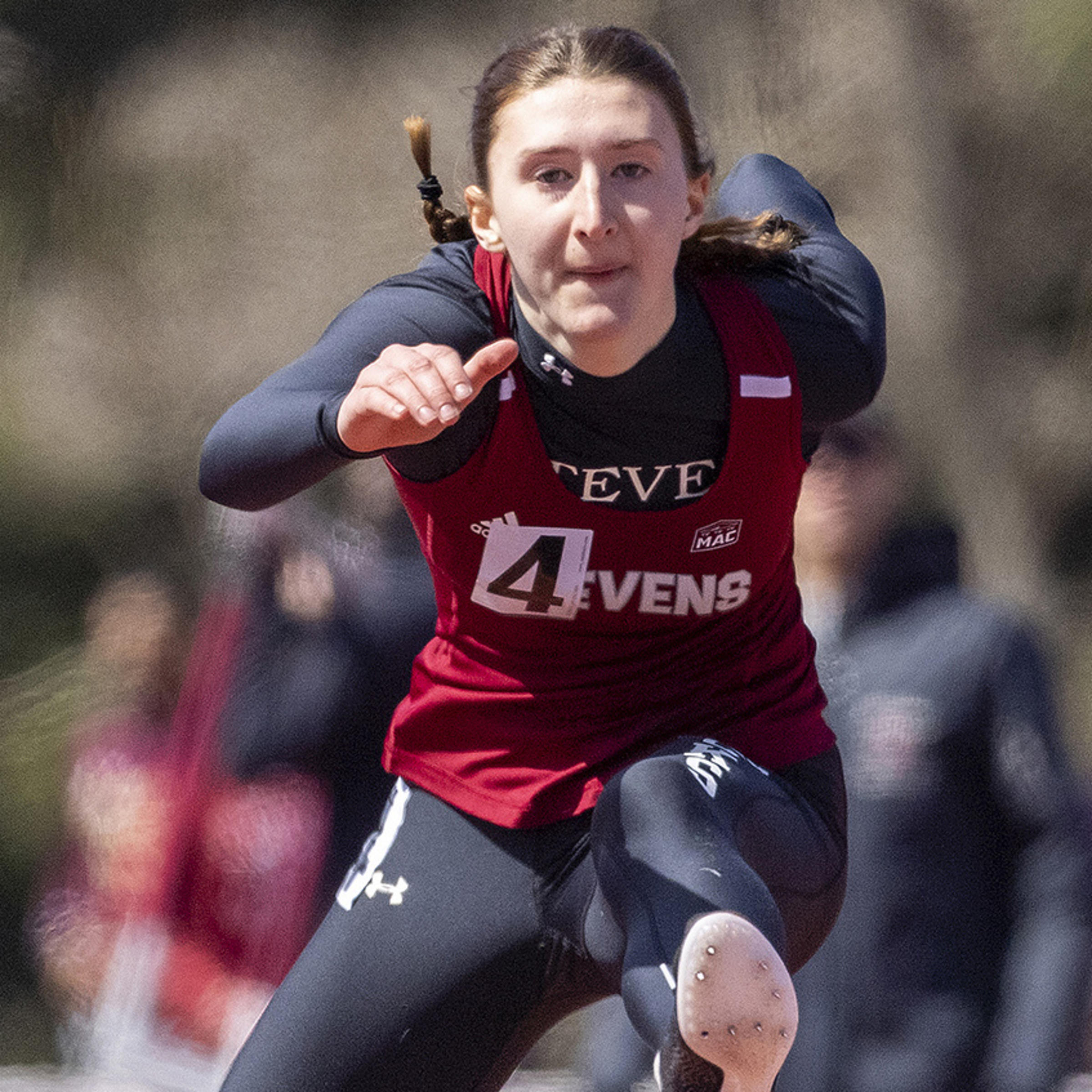 Stevens student-athlete Laura Mathews competing in outdoor hurdles.