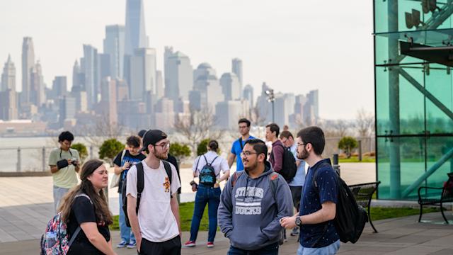 Students gathered at Babbio Patio overlooking the NYC skyline
