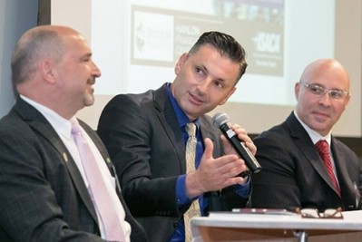 Three men at a table at the FinCyberSec conference