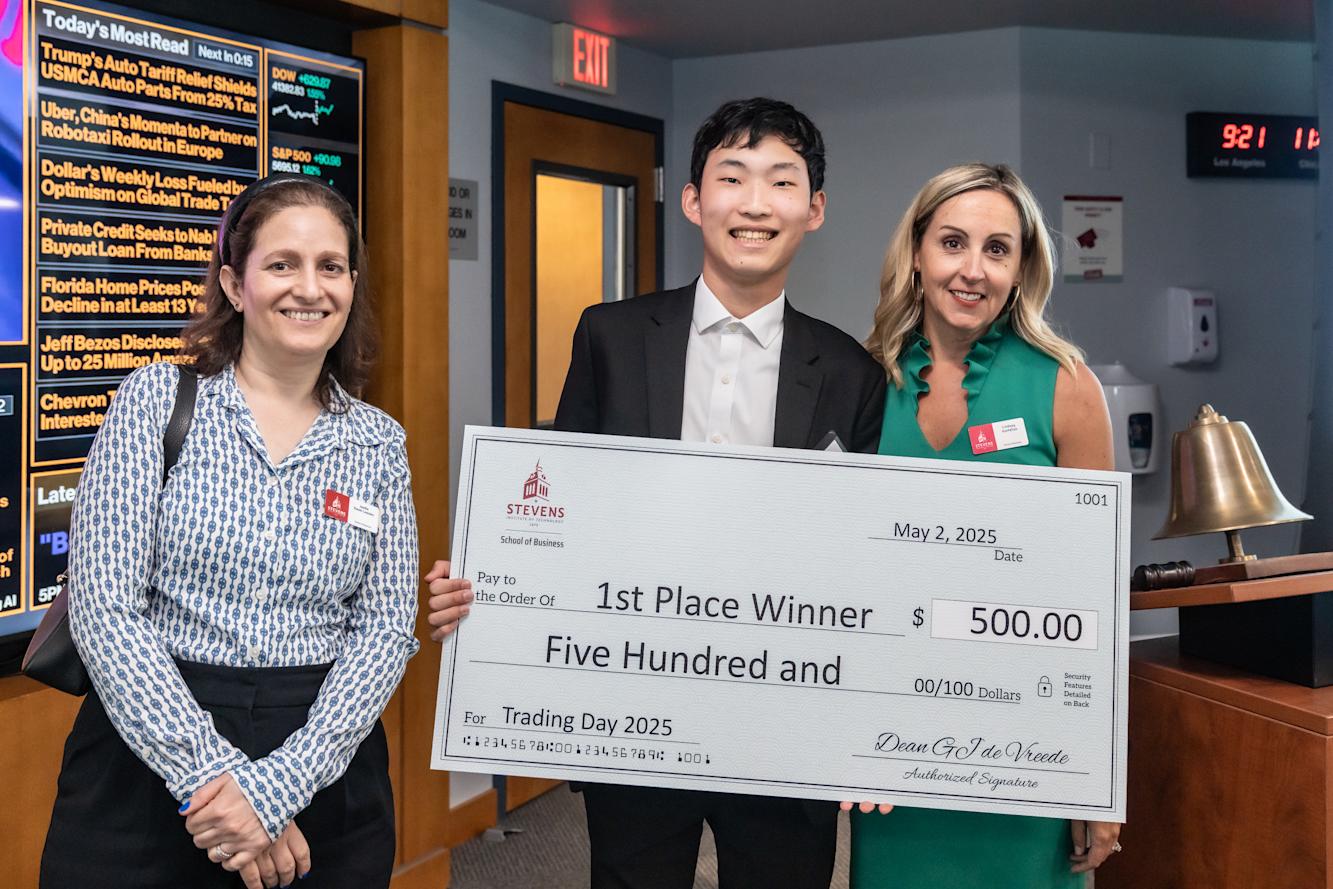 Contest winner Jackson Lin poses with Joelle Saad-Lessler and Lindsay Hartelius while holding a giant first-place check for $500.