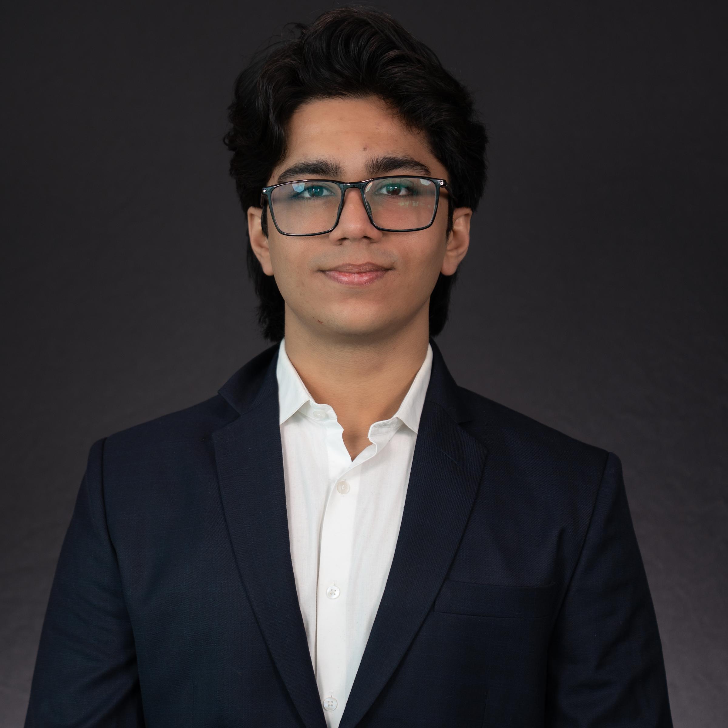 Headshot of Aditya Bhatia dressed in professional attire.