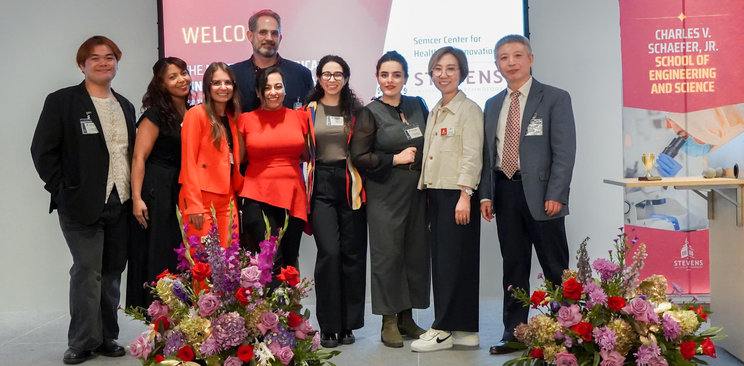 Several organizers of the 2024 Next-Gen Symposium on the event's stage.