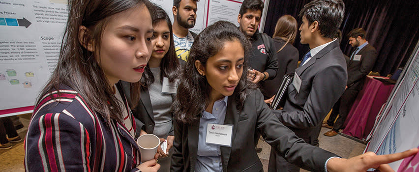 People in front of research posters
