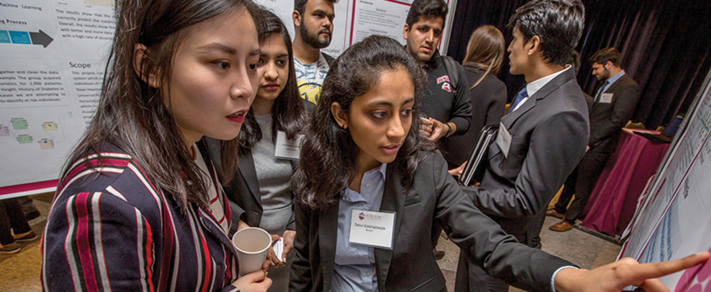 People in front of research posters
